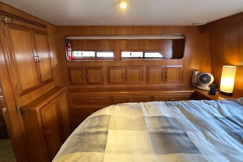 Rover Yacht Photos Pics Cozy 1993 Ocean Alexander 460 yacht cabin with wooden cabinetry and soft lighting.