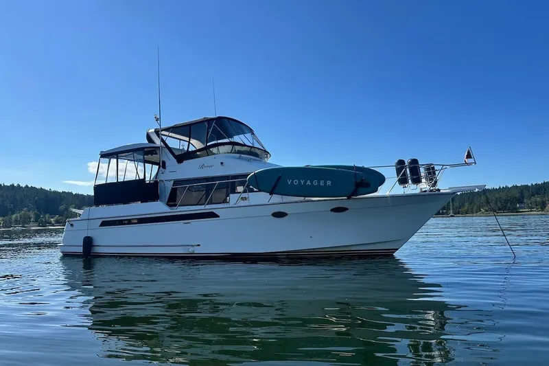 Rover Yacht Photos Pics 1993 Ocean Alexander 460 yacht anchored on calm water under clear blue sky.