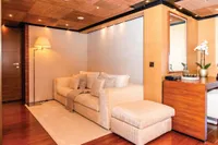 Luxurious yacht interior with cozy seating, wooden accents, and elegant decor, ISA Custom 2012 model.