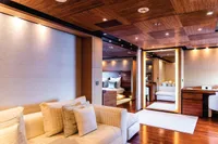 Luxurious yacht interior with modern design, featuring wooden accents and plush seating, ISA Custom 2012.