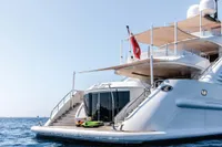 Luxurious 2012 ISA Custom yacht with sleek design, docked on calm blue waters.