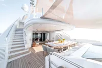 Luxurious yacht deck with dining area, modern design, and elegant seating, ISA Custom 2012 model.