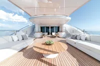 Luxurious ISA Custom yacht deck with elegant seating, wooden flooring, and ocean view, 2012 model.