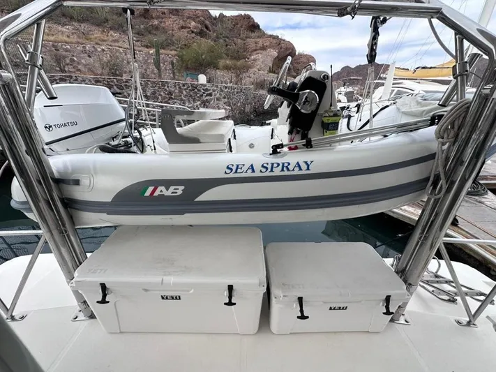 Seascape Yacht Photos Pics Inflatable boat "Sea Spray" on Leopard 39 catamaran, 2012 model, docked with storage boxes.