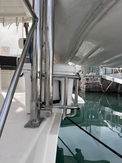 Seascape Yacht Photos Pics 2012 Leopard 39 yacht detail, showcasing deck and railing near water.