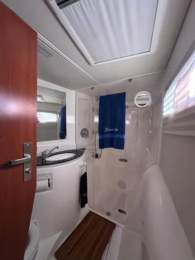 Seascape Yacht Photos Pics Bathroom interior of a 2012 Leopard 39 yacht with modern fixtures and skylight.