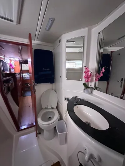 Seascape Yacht Photos Pics Interior of 2012 Leopard 39 yacht bathroom with modern fixtures and floral decor.