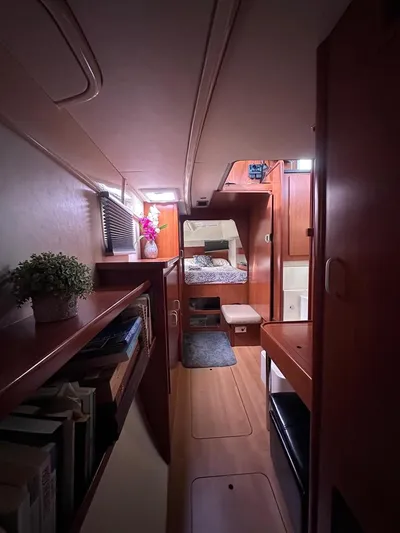 Seascape Yacht Photos Pics Interior of 2012 Leopard 39 yacht, featuring cozy cabin with wooden furnishings and decor.