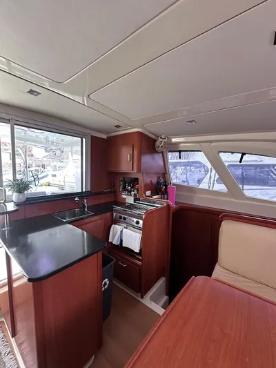 Seascape Yacht Photos Pics Interior of 2012 Leopard 39 yacht with modern kitchen and dining area.