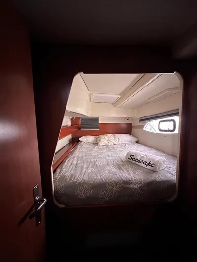 Seascape Yacht Photos Pics Cozy cabin interior of 2012 Leopard 39 yacht with a comfortable bed.