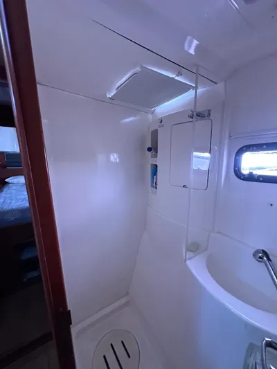 Seascape Yacht Photos Pics Bathroom interior of a 2012 Leopard 39 yacht, featuring a compact shower and sink.