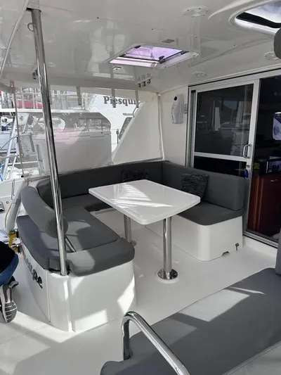 Seascape Yacht Photos Pics Leopard 39 catamaran cockpit with seating and table, 2012 model.