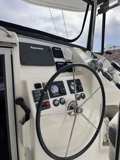 Seascape Yacht Photos Pics Steering wheel and control panel of a 2012 Leopard 39 yacht.