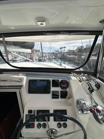 Seascape Yacht Photos Pics Leopard 39 yacht cockpit view, showcasing navigation controls and marina backdrop, 2012 model.