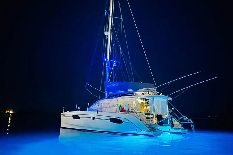 Seascape Yacht Photos Pics Sailing catamaran Leopard 39, 2012 model, illuminated at night with blue underwater lights.