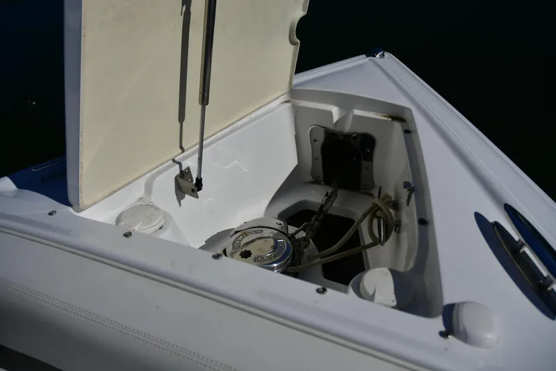  Yacht Photos Pics Open anchor compartment on 2016 Cobalt 336 boat, showing ropes and mechanism.
