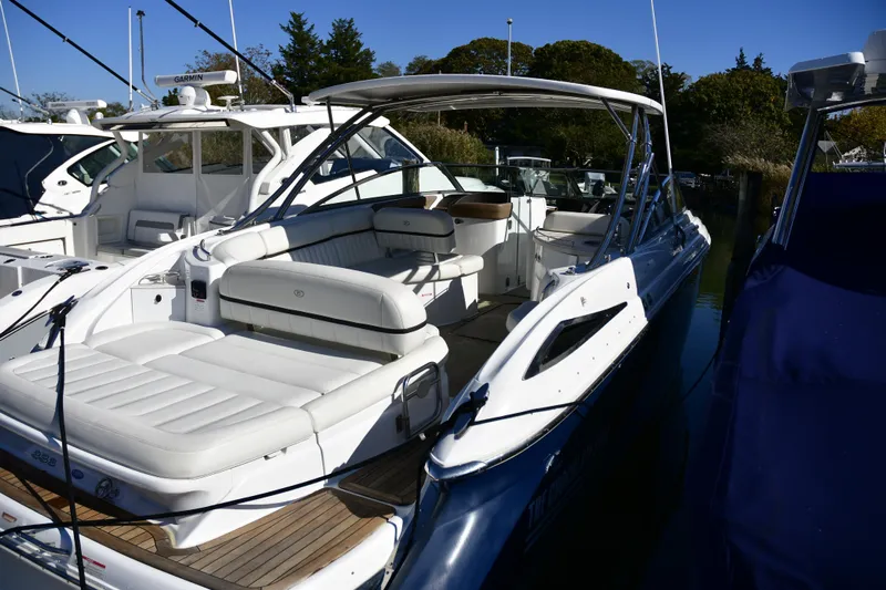  Yacht Photos Pics 2016 Cobalt 336 boat docked, featuring spacious seating and sleek design.
