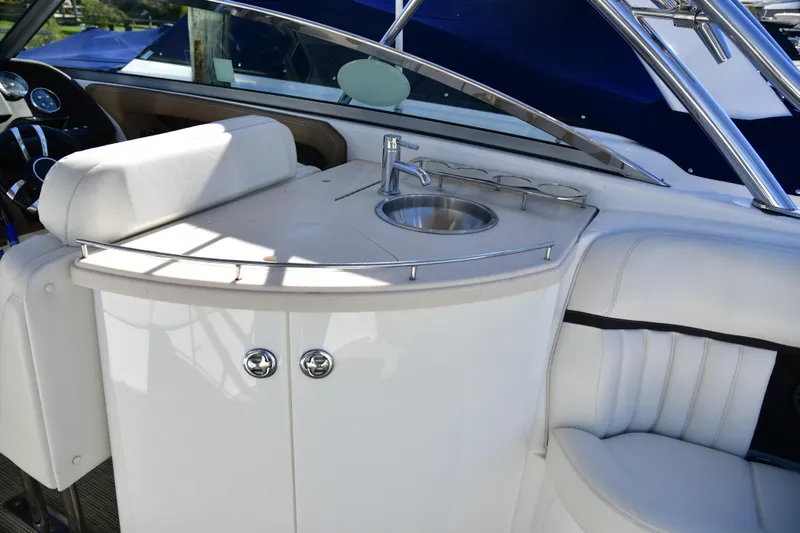  Yacht Photos Pics 2016 Cobalt 336 boat interior with sink and seating area.