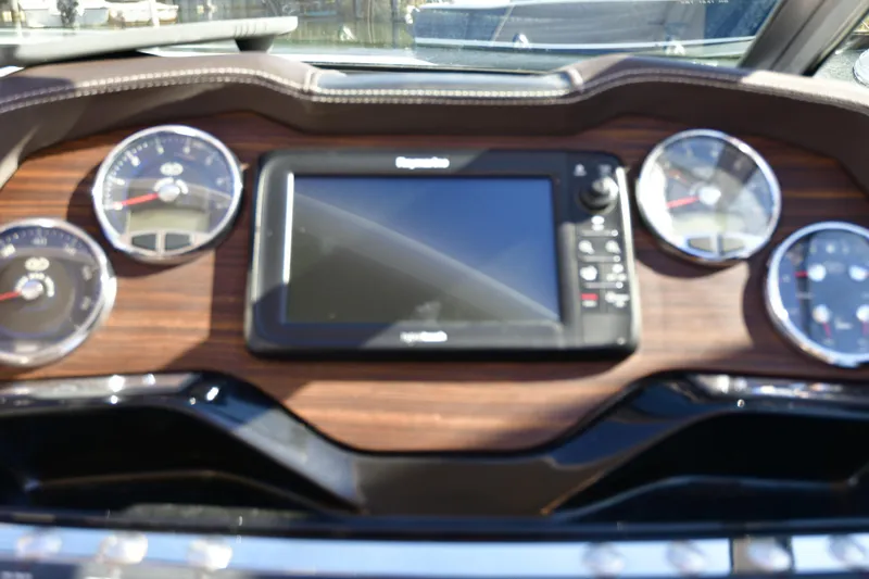  Yacht Photos Pics Dashboard of a 2016 Cobalt 336 boat with gauges and a central display.