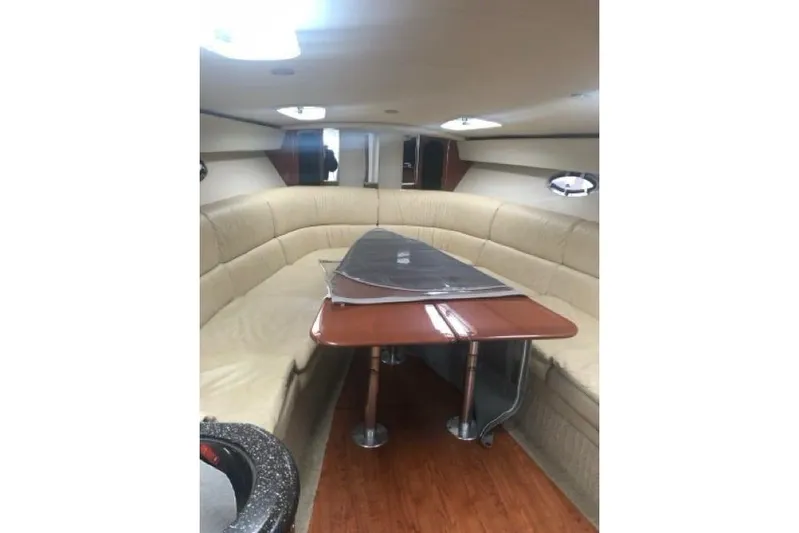 Silver Lining Yacht Photos Pics Luxurious interior of 2008 Formula 400 Super Sport yacht with beige seating and wooden table.