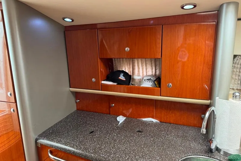 Silver Lining Yacht Photos Pics 2008 Formula 400 Super Sport yacht interior with wooden cabinets and granite countertop.