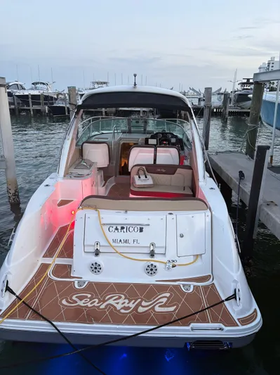  Yacht Photos Pics 2008 Sea Ray 330 Sundancer docked, featuring spacious deck and elegant interior.