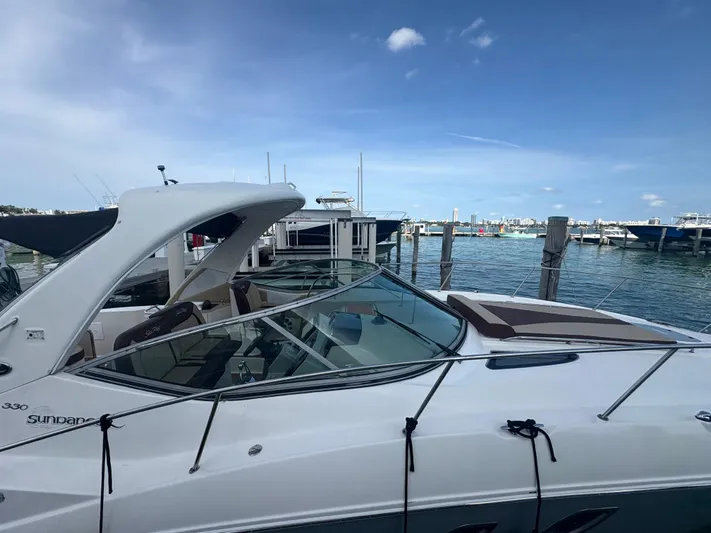  Yacht Photos Pics 2008 Sea Ray 330 Sundancer docked at marina under clear blue sky.