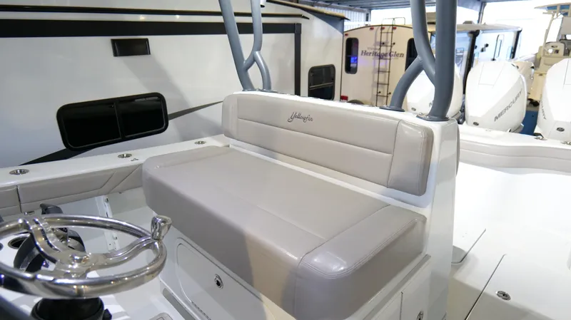 Engine Warranty X Trailer Yacht Photos Pics 2022 Yellowfin 34 boat interior with cushioned seating and steering wheel.