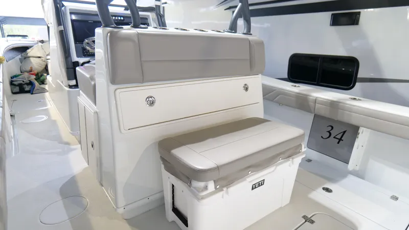 Engine Warranty X Trailer Yacht Photos Pics 2022 Yellowfin 34 boat interior with seating and storage.