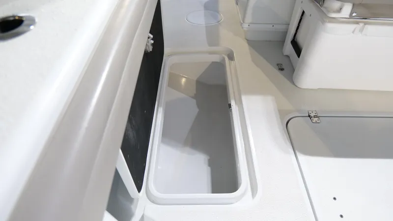 Engine Warranty X Trailer Yacht Photos Pics 2022 Yellowfin 34 boat interior storage compartment, white finish, open hatch.