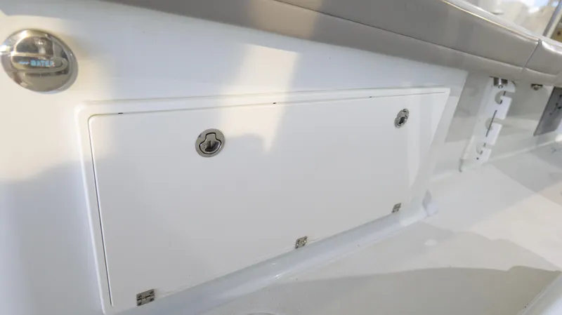 Engine Warranty X Trailer Yacht Photos Pics 2022 Yellowfin 34 boat storage compartment with secure latch and sleek design.