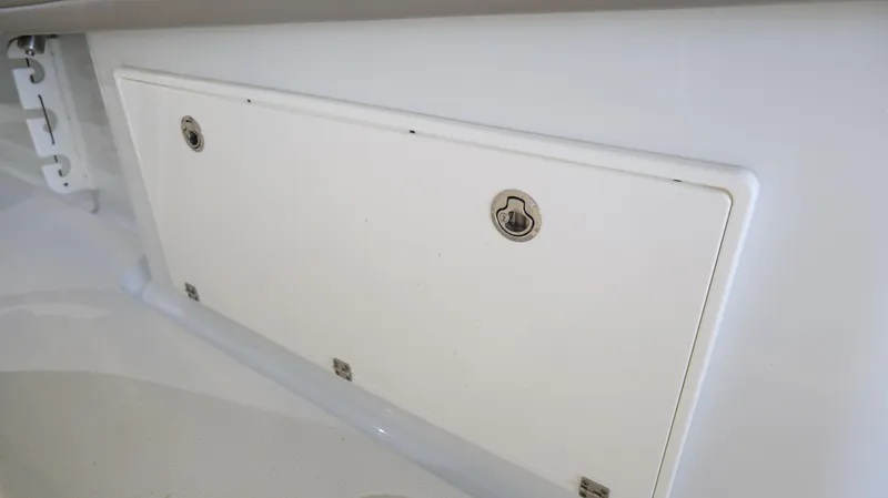 Engine Warranty X Trailer Yacht Photos Pics Storage compartment on a 2022 Yellowfin 34 boat, featuring secure latches.