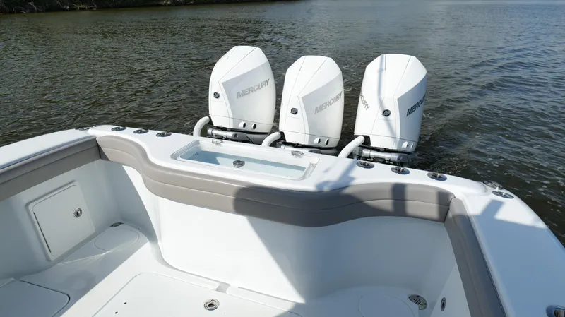 Engine Warranty X Trailer Yacht Photos Pics 2022 Yellowfin 34 boat with triple Mercury outboard engines on calm water.
