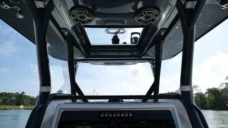 Engine Warranty X Trailer Yacht Photos Pics 2022 Yellowfin 34 boat interior with modern dashboard and overhead speakers.