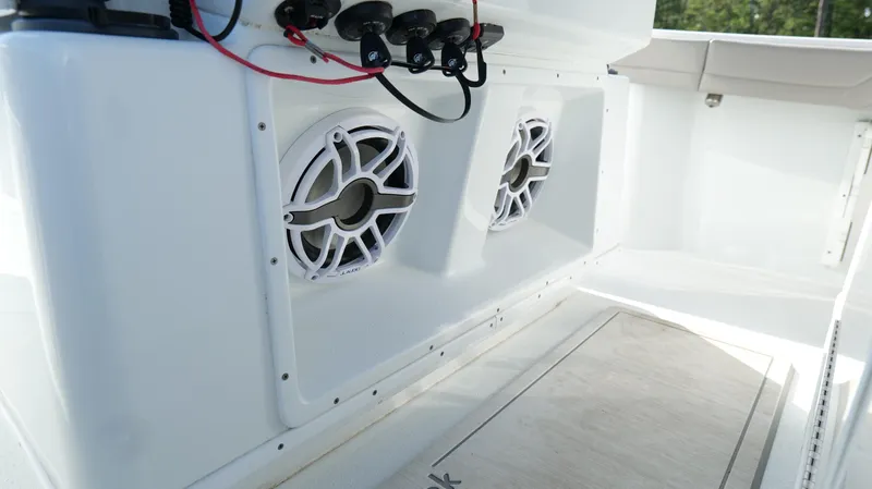 Engine Warranty X Trailer Yacht Photos Pics 2022 Yellowfin 34 boat speakers and control panel in white interior.