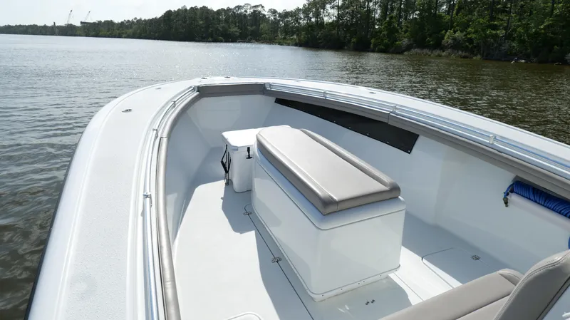 Engine Warranty X Trailer Yacht Photos Pics 2022 Yellowfin 34 boat on calm water, featuring spacious seating and sleek design.
