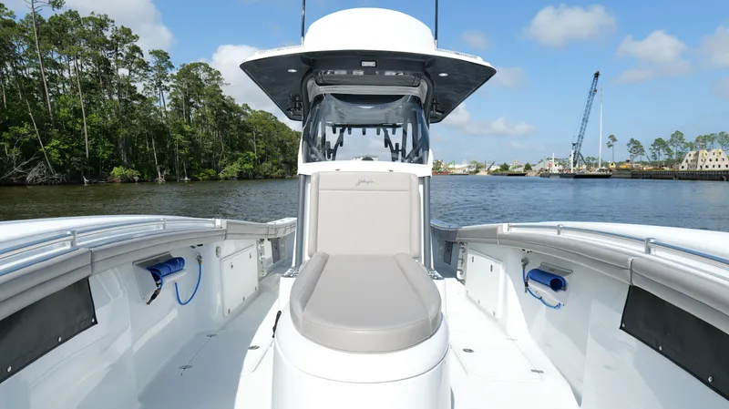 Engine Warranty X Trailer Yacht Photos Pics 2022 Yellowfin 34 boat on calm water, featuring spacious deck and modern design.