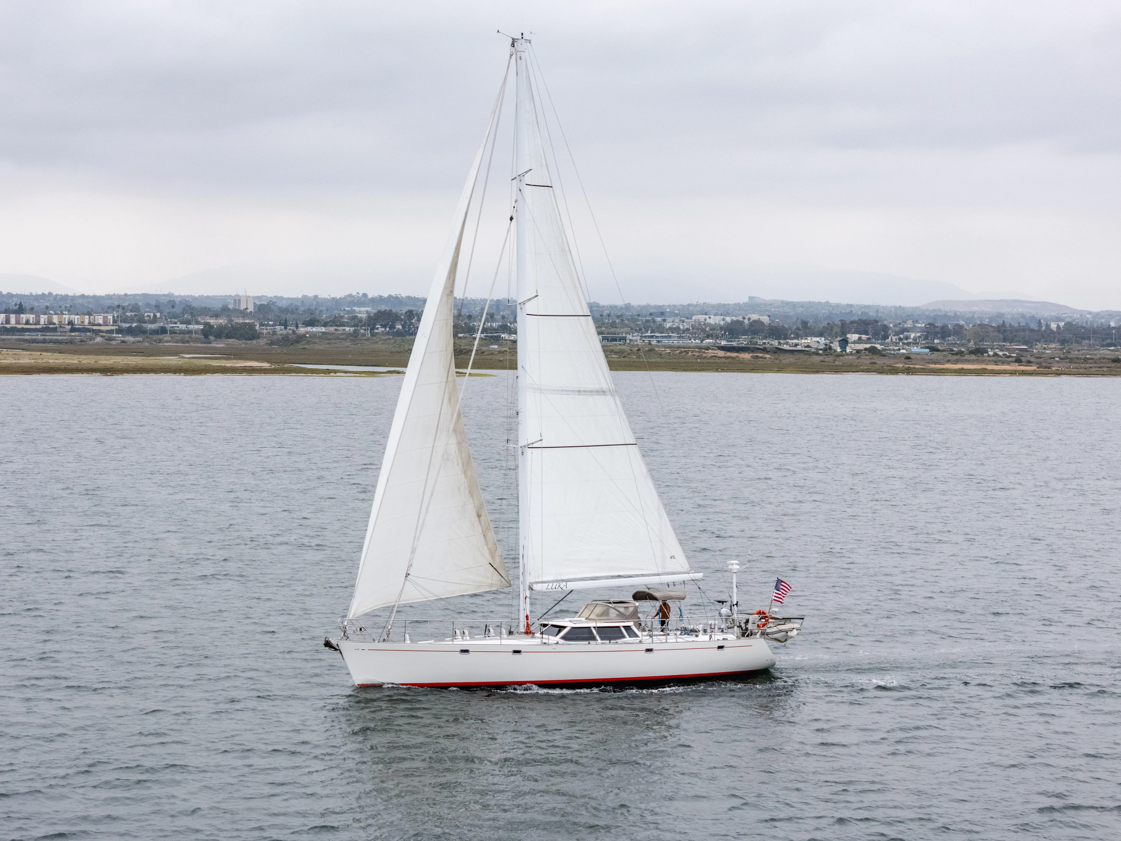 Luka Yacht Photos Pics Sailing yacht Farr 60 Pilot House 1997 on open water, overcast sky.