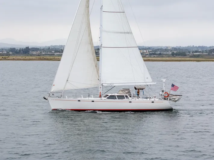Luka Yacht Photos Pics Sailing yacht Farr 60 Pilot House 1997 on calm waters with sails raised.