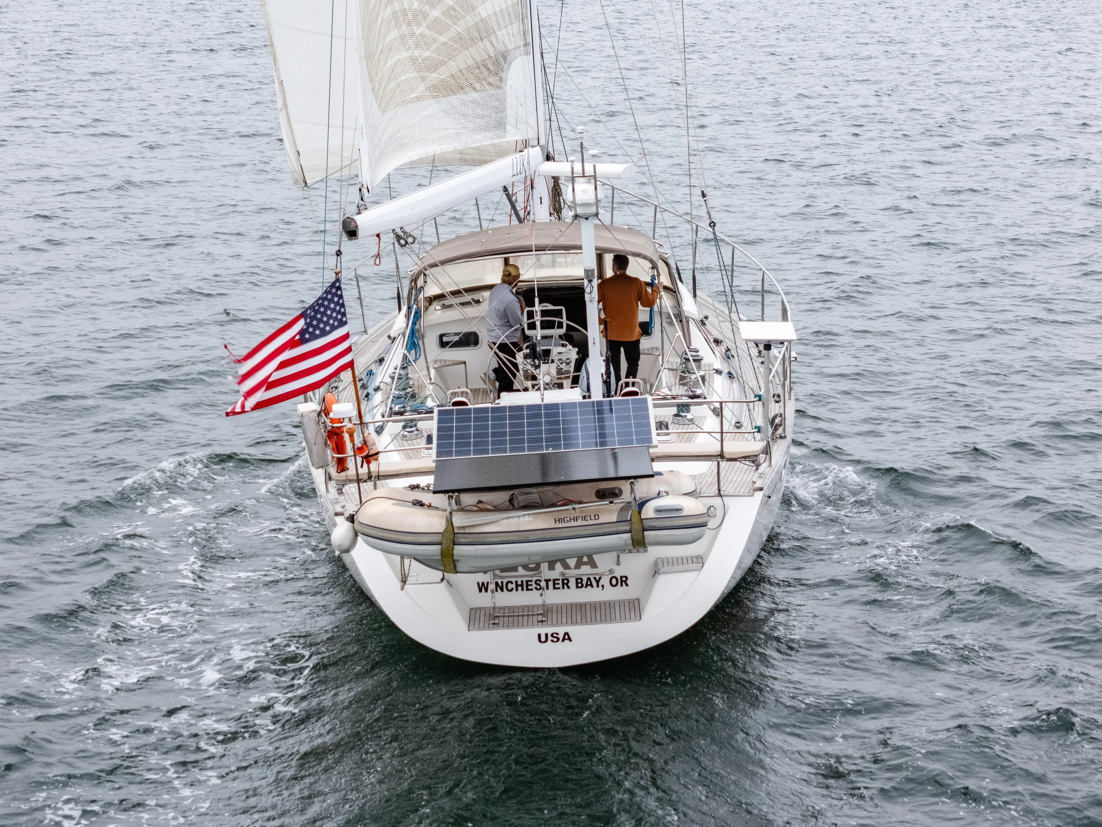 Luka Yacht Photos Pics Sailing yacht Farr 60 Pilot House 1997 on open water, displaying American flag.