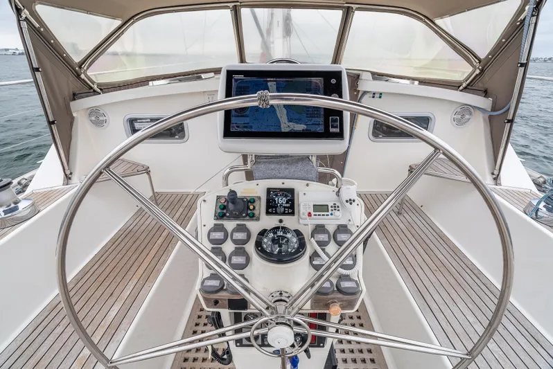 Luka Yacht Photos Pics 1997 Farr 60 Pilot House yacht helm with navigation equipment and steering wheel.