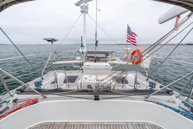 Luka Yacht Photos Pics Sailing yacht Farr 60 Pilot House 1997 on open water with American flag.