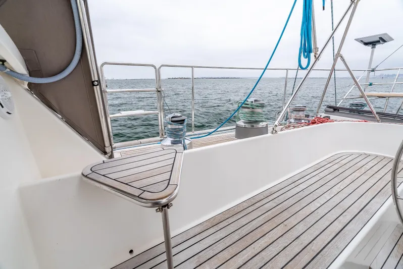 Luka Yacht Photos Pics Deck view of 1997 Farr 60 Pilot House yacht with ocean backdrop.