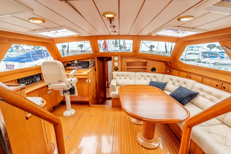 Luka Yacht Photos Pics Luxurious interior of 1997 Farr 60 Pilot House yacht with wood finish and plush seating.