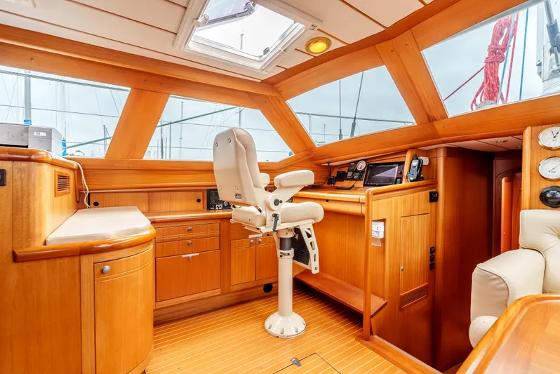 Luka Yacht Photos Pics Luxurious 1997 Farr 60 Pilot House interior with wooden finish and navigation equipment.