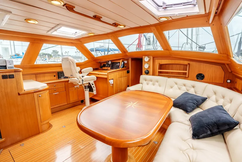 Luka Yacht Photos Pics Luxurious 1997 Farr 60 Pilot House interior with elegant wood finish and plush seating.