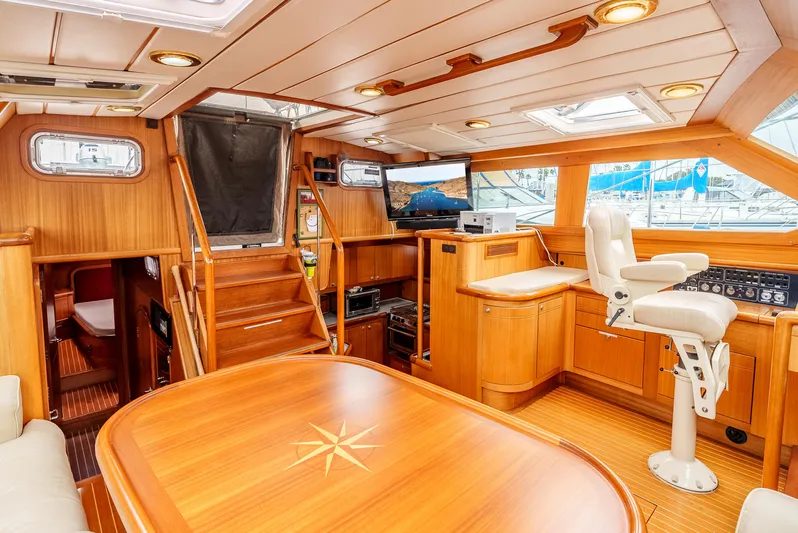 Luka Yacht Photos Pics Luxurious 1997 Farr 60 Pilot House interior with wood finish and navigation station.