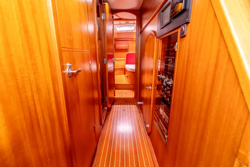 Luka Yacht Photos Pics Interior of 1997 Farr 60 Pilot House yacht with wooden paneling and cozy cabin.