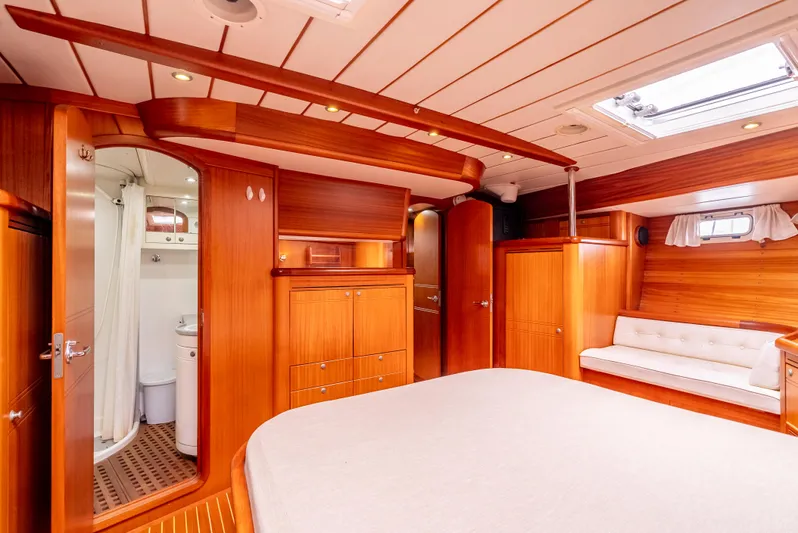 Luka Yacht Photos Pics Luxurious wood-finished interior of a 1997 Farr 60 Pilot House yacht cabin.