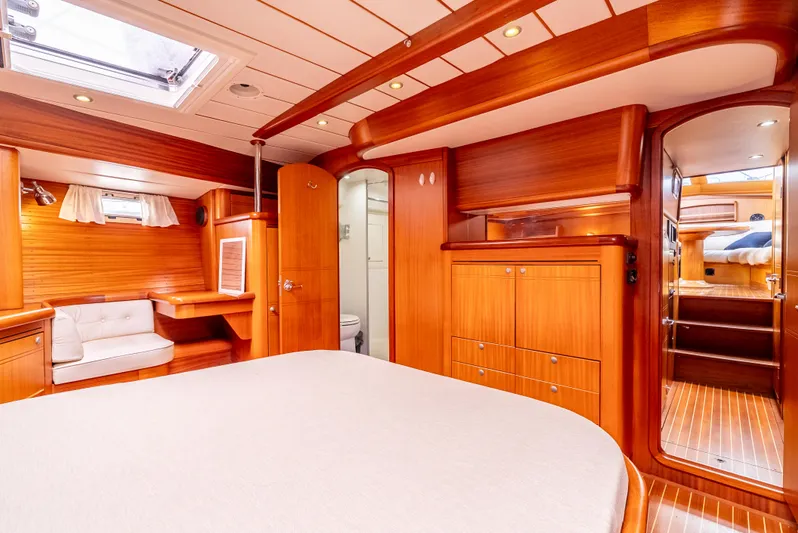 Luka Yacht Photos Pics Luxurious interior of 1997 Farr 60 Pilot House yacht with wood finish and cozy seating.